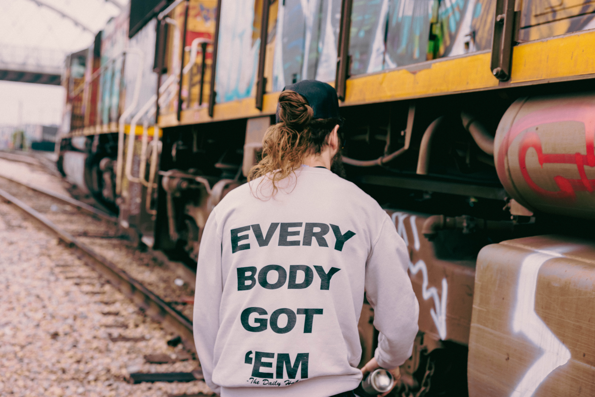 Everybody Got 'Em Motto Crewneck Sweater (Limited Edition)